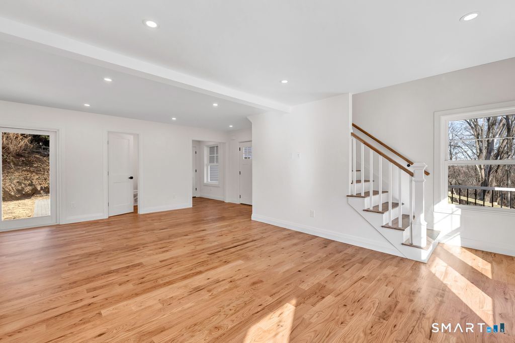 100 Tashua Road Trumbull, CT 06611 - Photo 3 of 26 a view of an empty room with window and wooden floor