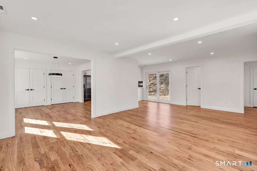 100 Tashua Road Trumbull, CT 06611 - Photo 4 of 26 a view of an empty room with wooden floor