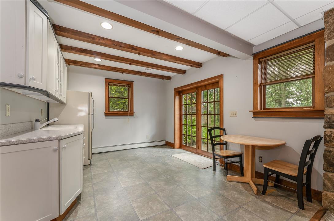 465 Raubsville Road Easton, PA 18042 - Photo 52 of 60 Exposed beams and recessed lighting highlight this well-lit eat-in kitchen with outdoor access.