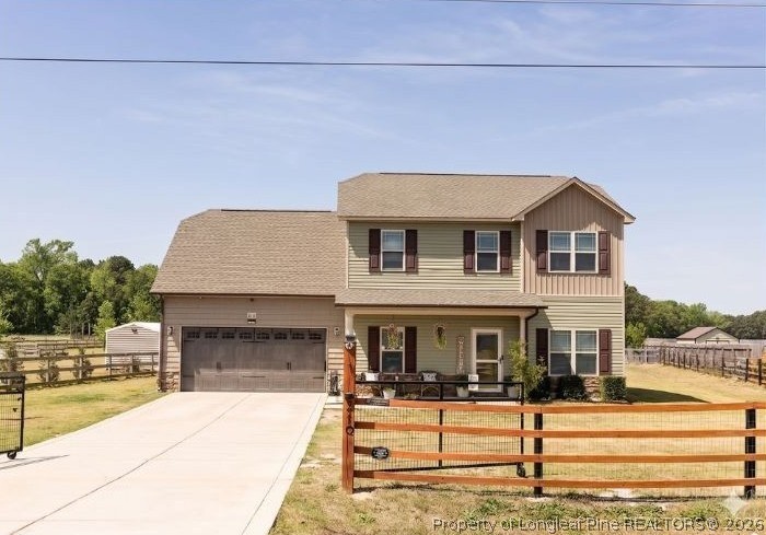 210 McGougan Road Lumber Bridge, NC 28357 - Photo 2 of 47 a front view of a house with a yard