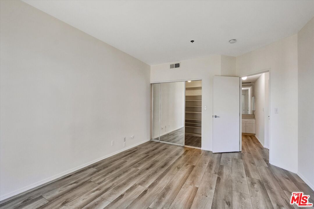 10600 Wilshire Boulevard, Unit 519 Los Angeles, CA 90024 - Photo 11 of 27 a view of a room with wooden floor and window