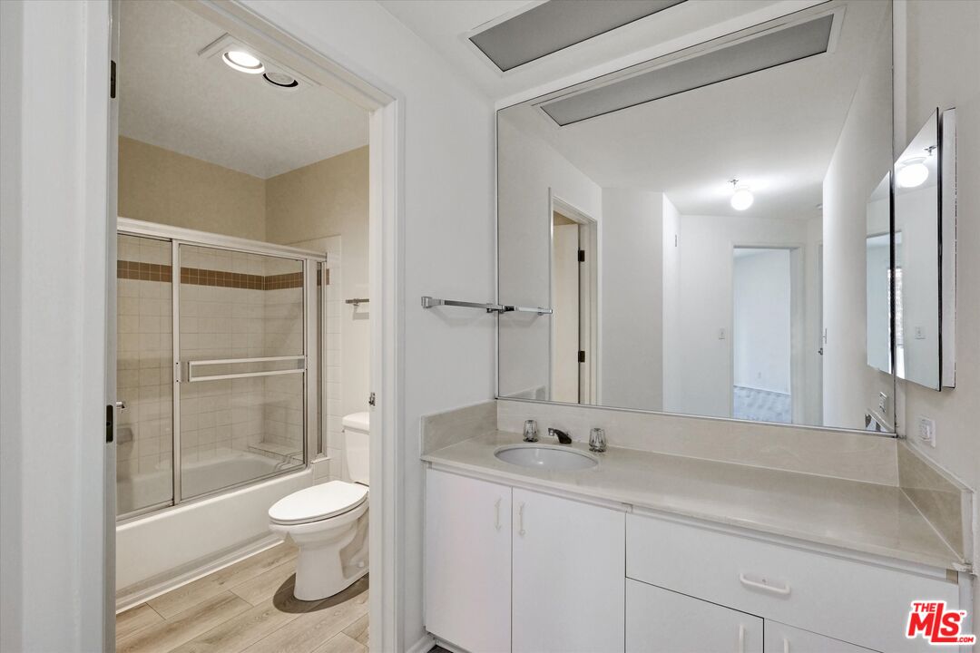 10600 Wilshire Boulevard, Unit 519 Los Angeles, CA 90024 - Photo 16 of 27 a bathroom with a toilet sink and shower