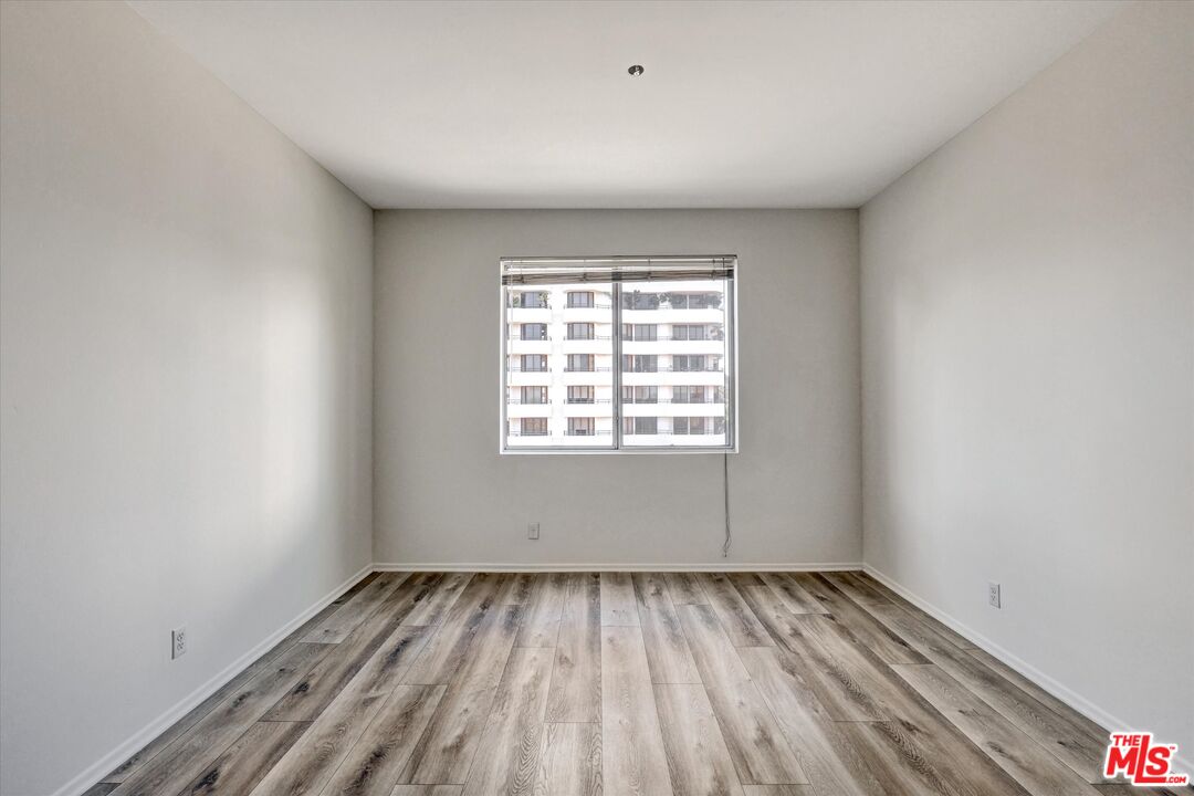 10600 Wilshire Boulevard, Unit 519 Los Angeles, CA 90024 - Photo 18 of 27 a view of a room with wooden floor and window