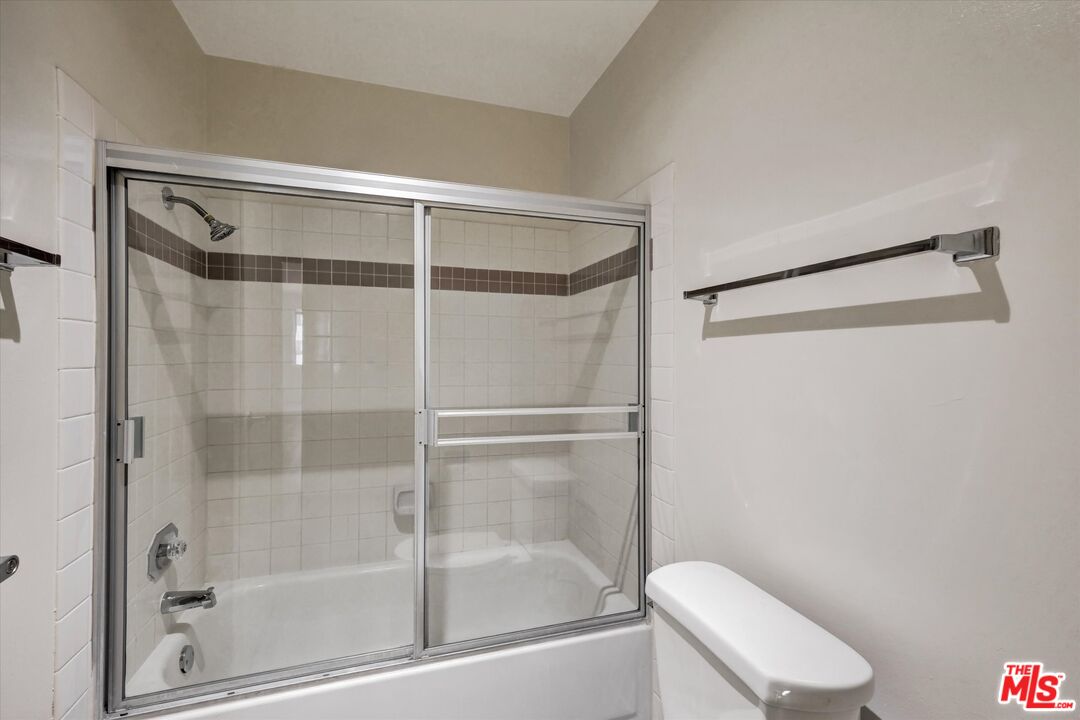 10600 Wilshire Boulevard, Unit 519 Los Angeles, CA 90024 - Photo 20 of 27 a bathroom with a shower and toilet