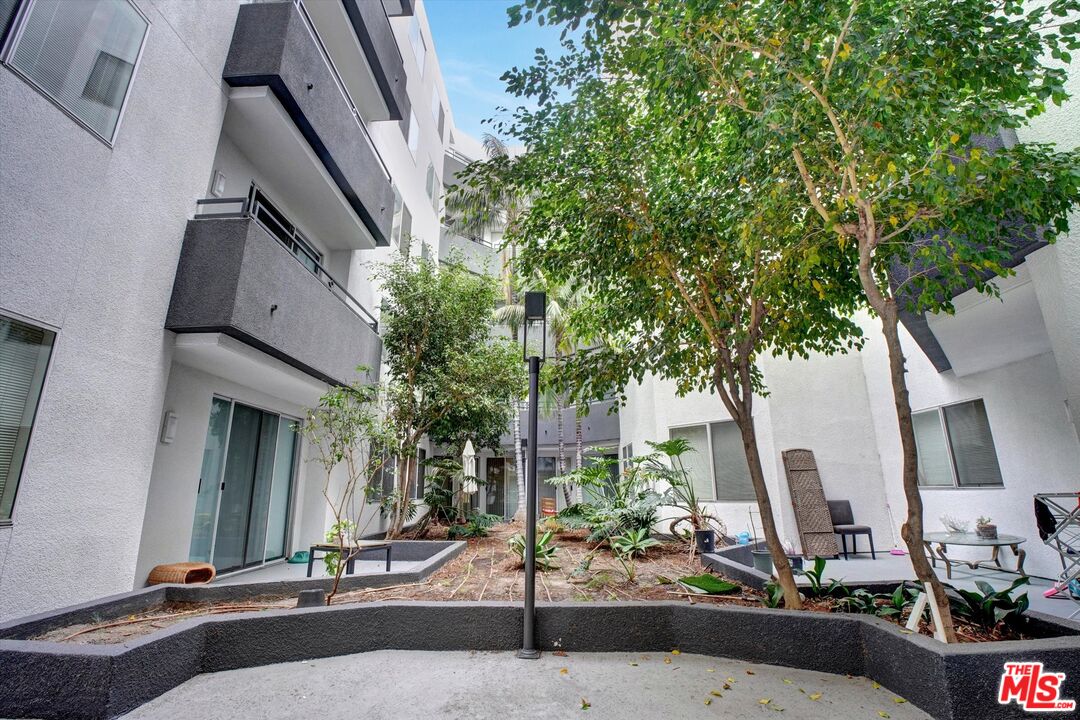 10600 Wilshire Boulevard, Unit 519 Los Angeles, CA 90024 - Photo 24 of 27 a building exterior with tall trees