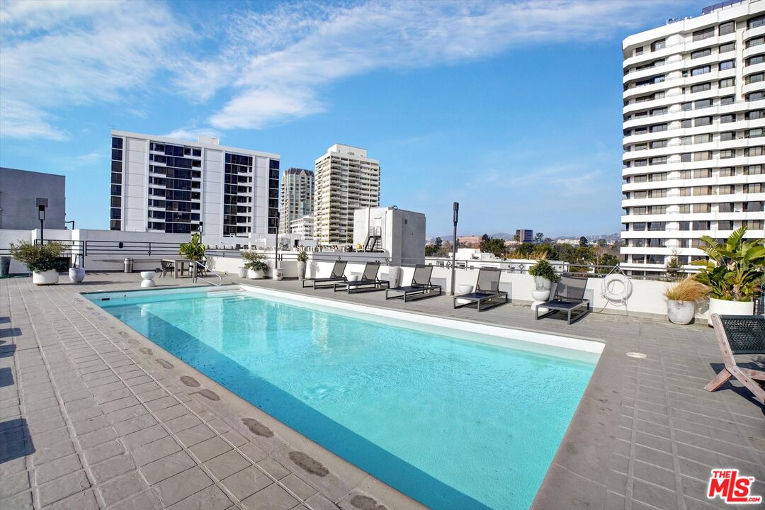 10600 Wilshire Boulevard, Unit 519 Los Angeles, CA 90024 - Photo 26 of 27 a view of swimming pool outdoor outdoor seating and city view