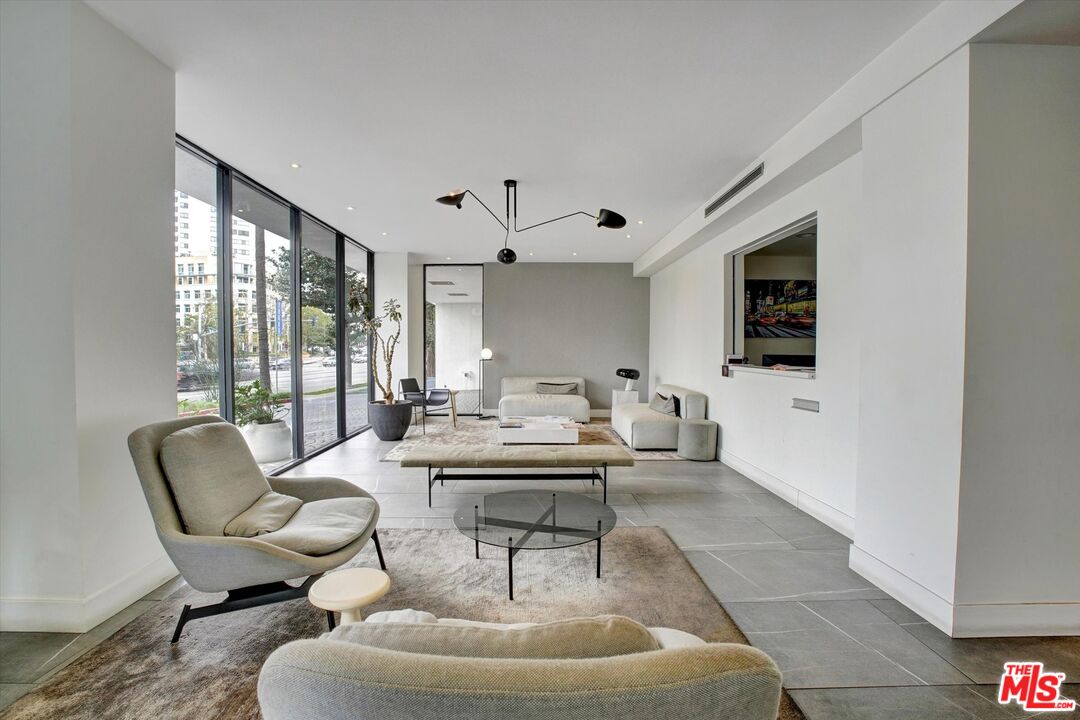 10600 Wilshire Boulevard, Unit 519 Los Angeles, CA 90024 - Photo 3 of 27 a living room with furniture and a flat screen tv