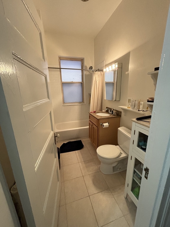 24 Peterborough Street, Unit 8 Boston, MA 02215 - Photo 5 of 9 a bathroom with a toilet a sink and shower