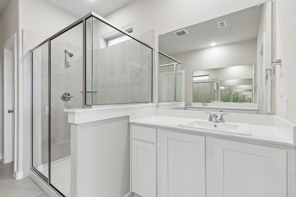 2303 Wind River Road Princeton, TX 75407 - Photo 15 of 32 Primary Bathroom in the Winters home plan by Trophy Signature Homes – REPRESENTATIVE PHOTO