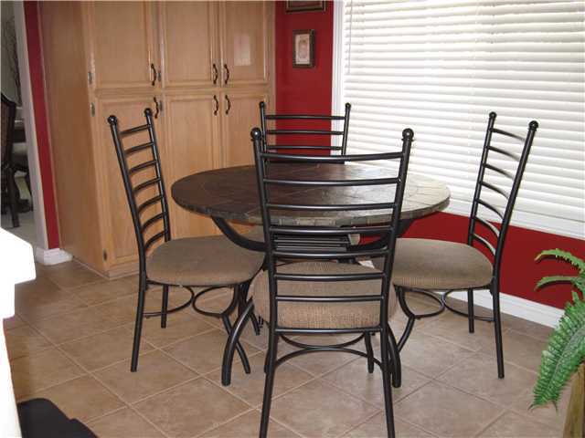 4824 Baroque Terrace Oceanside, CA 92057 - Photo 21 of 24 Convenient breakfast nook in kitchen with big picture windows.