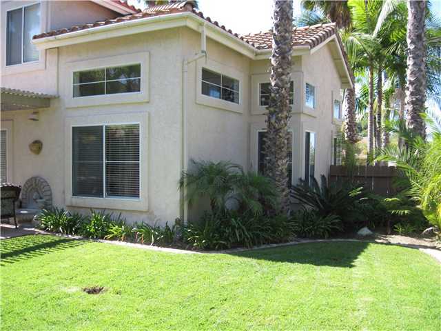 4824 Baroque Terrace Oceanside, CA 92057 - Photo 22 of 24 A view of one of the side yards that is all lawn. The other front side yard is a nicely enclosed enclave for yard and maintenace storage.