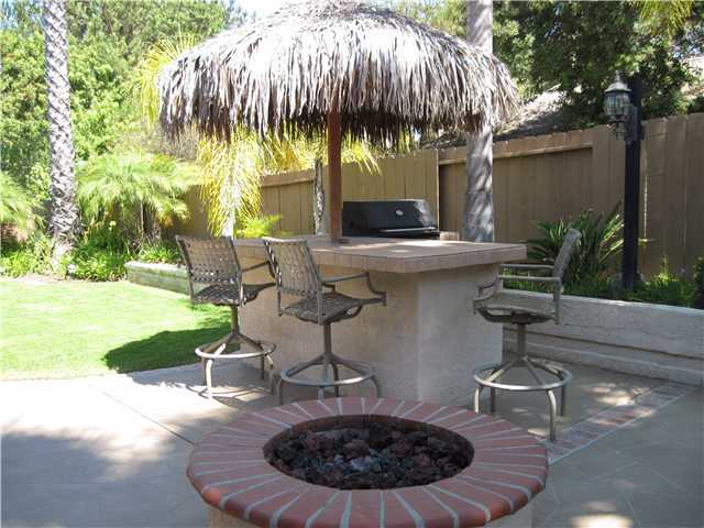 4824 Baroque Terrace Oceanside, CA 92057 - Photo 7 of 24 Built in outdoor BBQ with palapa and firepit.