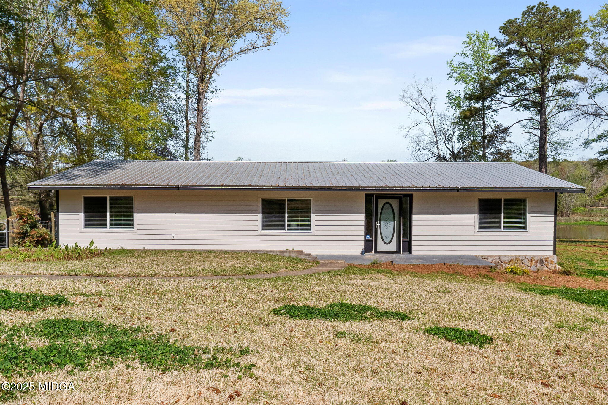 532 Henry Higgins Road Jackson, GA 30233 - Photo 1 of 43 a front view of house with yard and trees