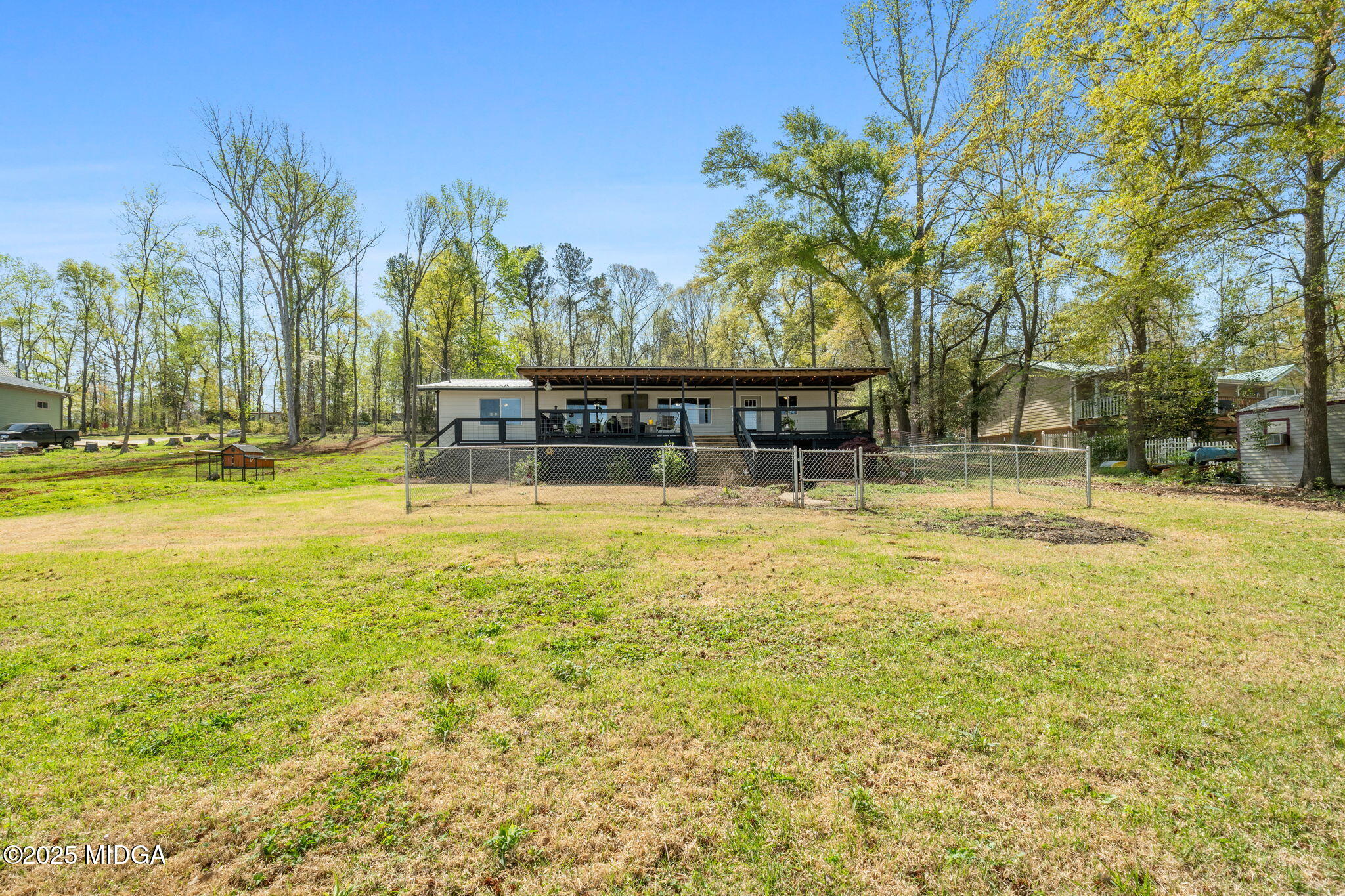 532 Henry Higgins Road Jackson, GA 30233 - Photo 27 of 43 a swimming pool with outdoor seating and yard