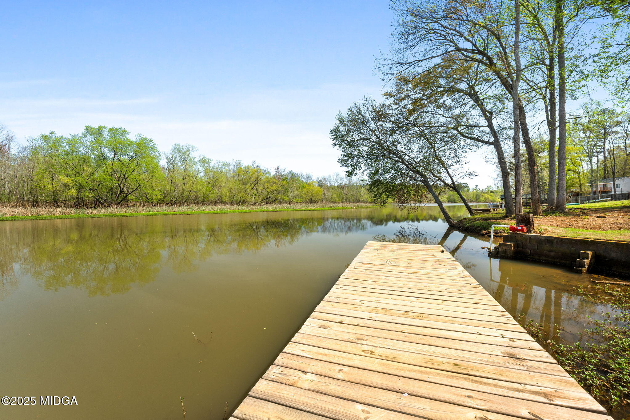 532 Henry Higgins Road Jackson, GA 30233 - Photo 29 of 43 a park with water view and a large trees with a wooden fence