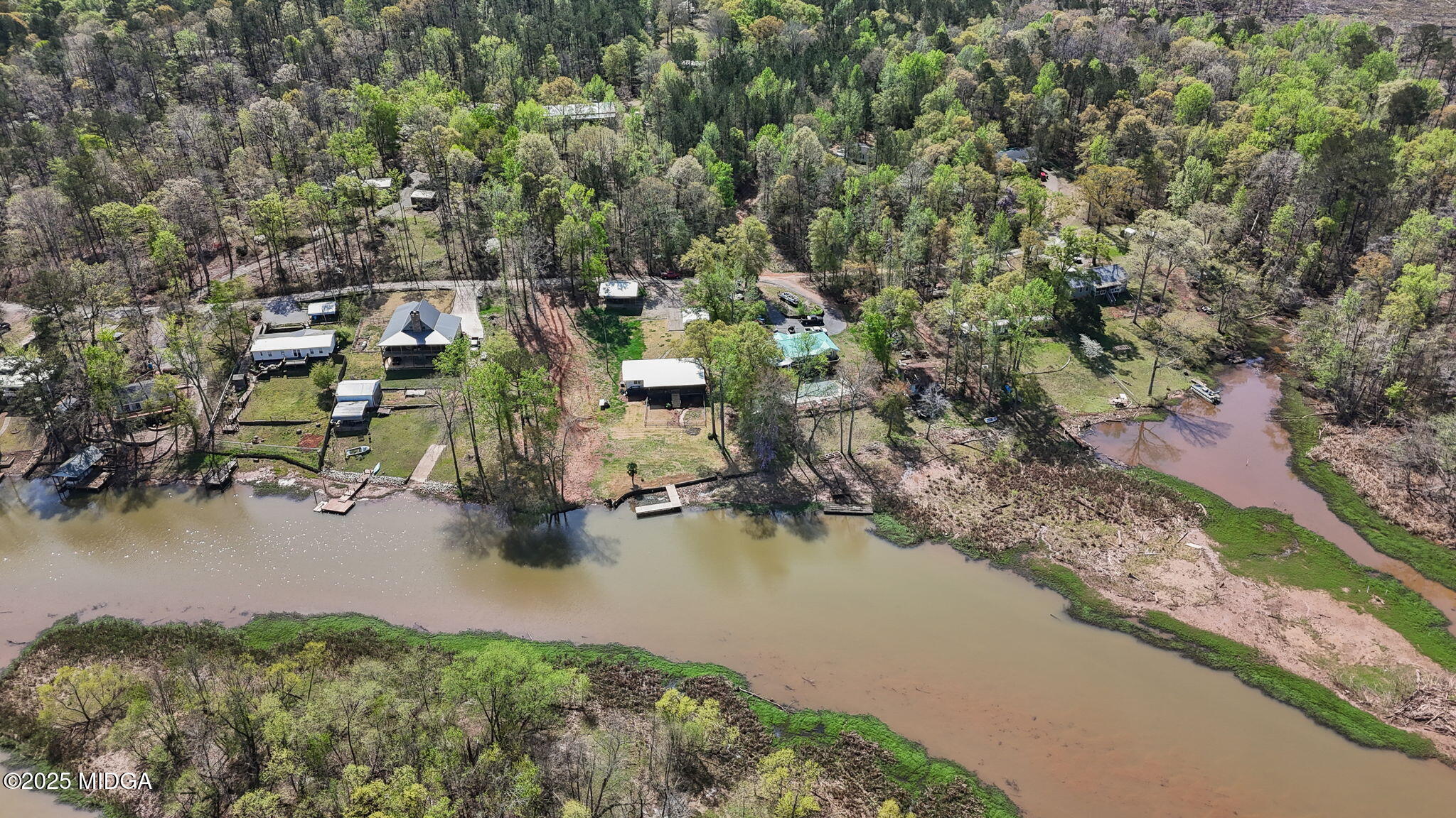 532 Henry Higgins Road Jackson, GA 30233 - Photo 39 of 43 an aerial view of a house with a yard and lake view