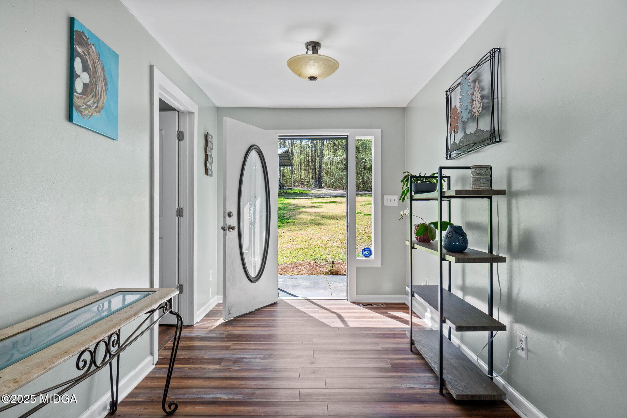 532 Henry Higgins Road Jackson, GA 30233 - Photo 4 of 43 a view of a hallway with wooden floor and entryway