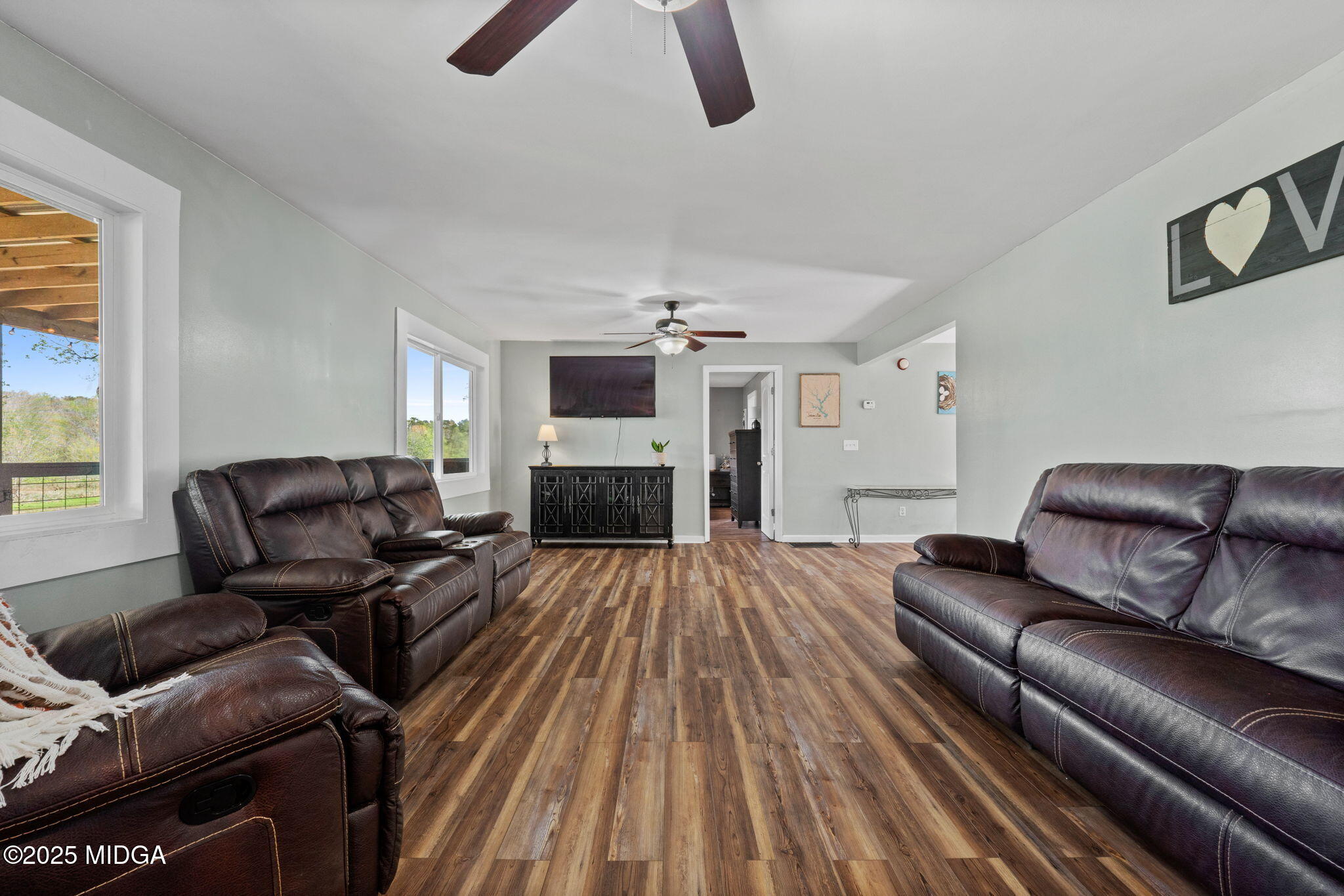 532 Henry Higgins Road Jackson, GA 30233 - Photo 7 of 43 a living room with furniture and a fireplace