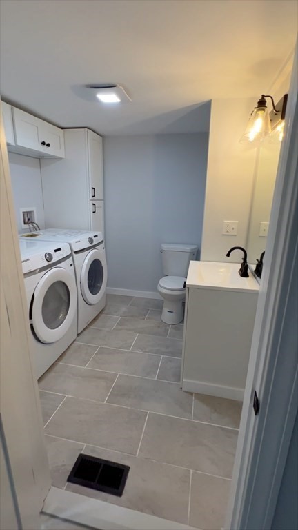 308 East Main Street Orange, MA 01364 - Photo 11 of 21 a bathroom with a sink a toilet and a mirror