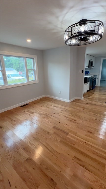 308 East Main Street Orange, MA 01364 - Photo 4 of 21 an empty room with a window