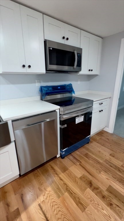 308 East Main Street Orange, MA 01364 - Photo 8 of 21 a kitchen with a stove and a microwave
