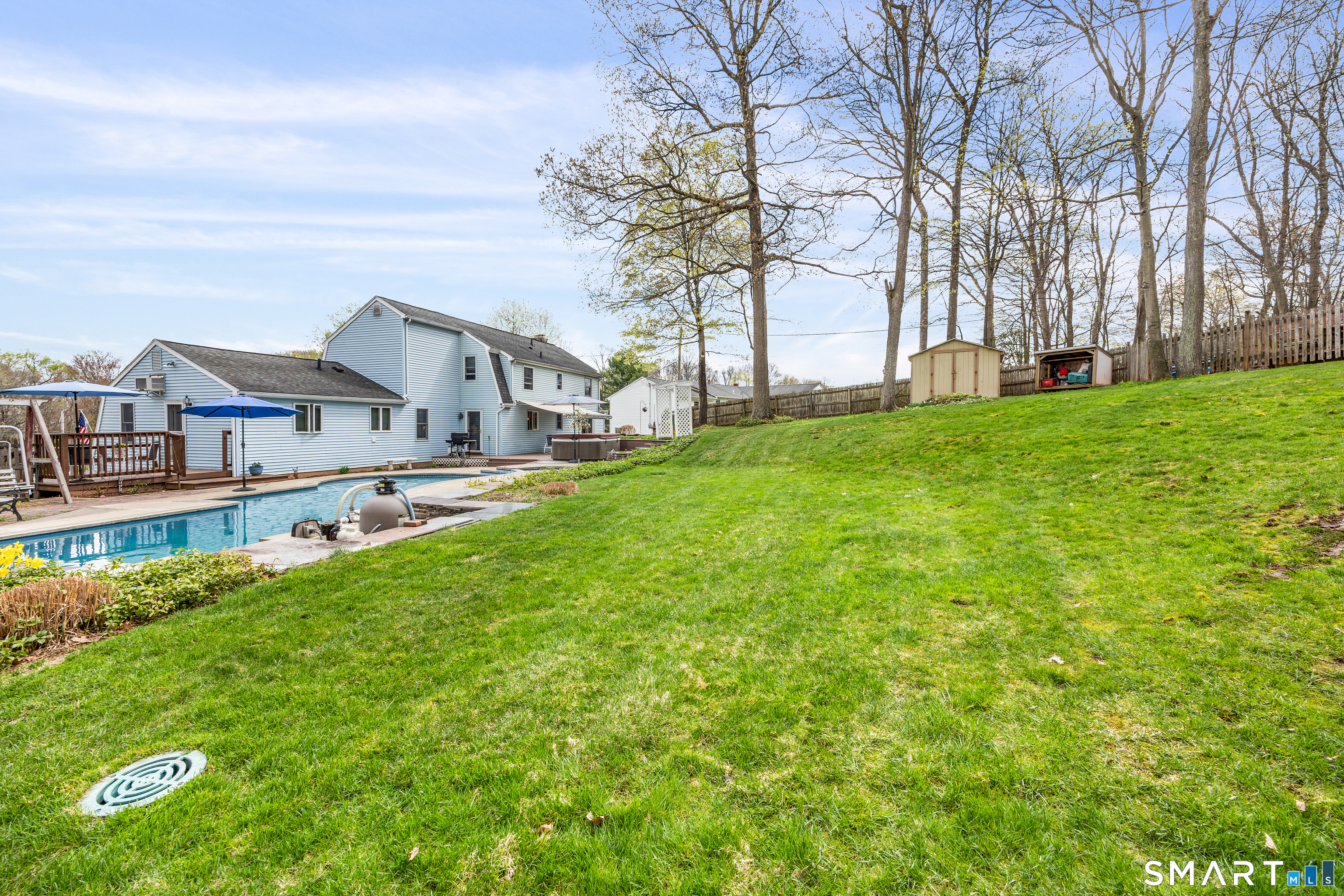 42 Chimney Sweep Road Wallingford, CT 06492 - Photo 5 of 40 a view of house with yard and trees in the background