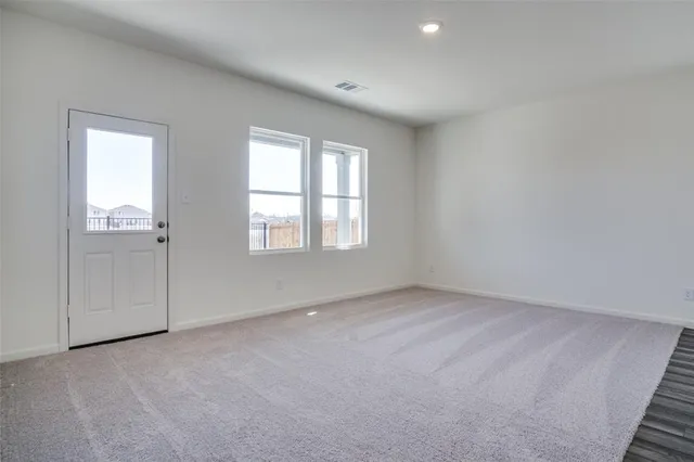 a kitchen with granite countertop cabinets stainless steel appliances a sink and a counter top space
