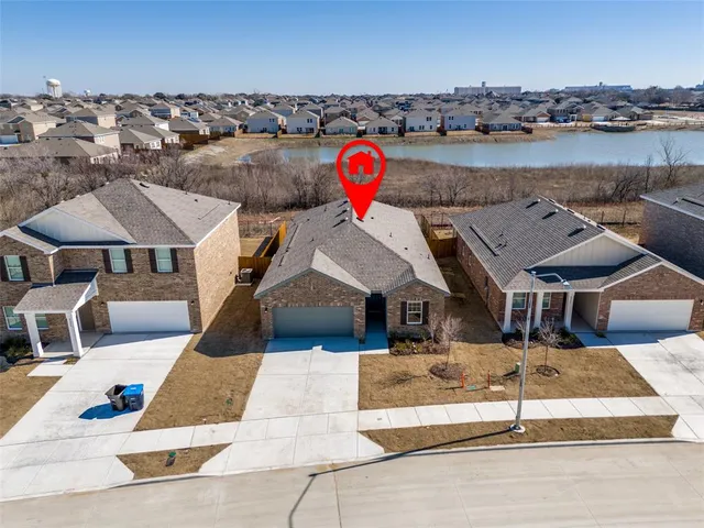 an aerial view of a house with sitting space