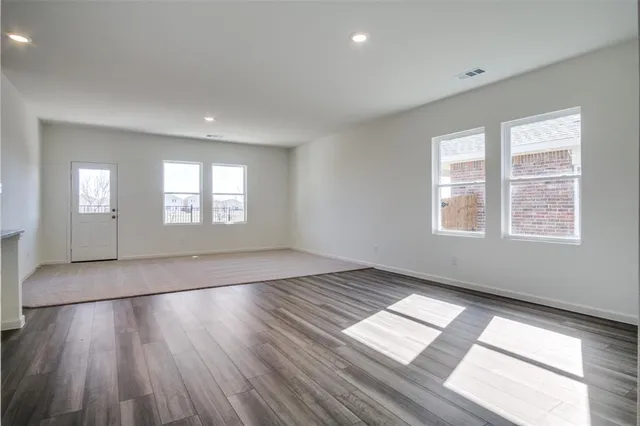 a view of kitchen with cabinets and wooden floor