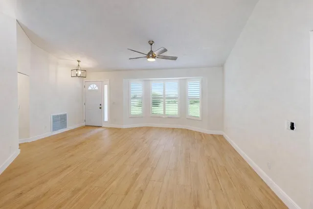 a view of an empty room with a window