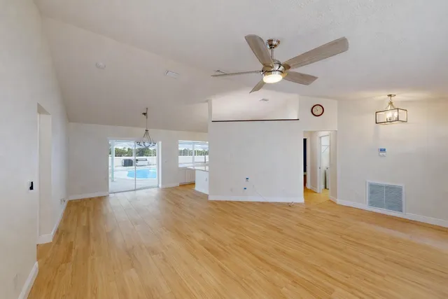 a kitchen with stainless steel appliances a refrigerator and a stove top oven