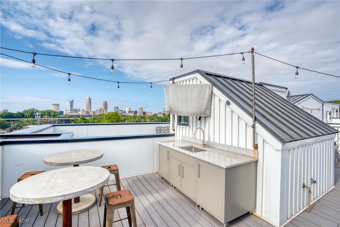 2317 Scranton Road Cleveland, OH 44113 - Photo 2 of 27 Wooden deck featuring a sink and a view of skyline