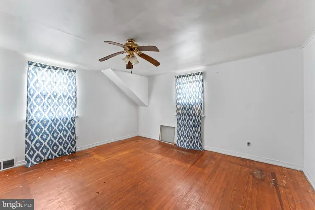 a view of empty room with windows