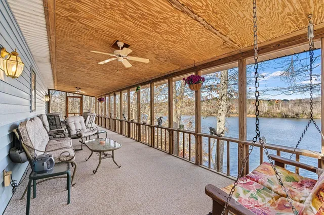 a balcony with furniture and a potted plant