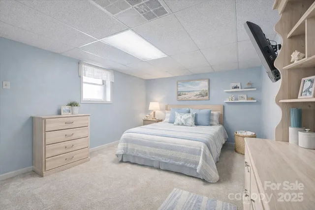 a bedroom with a bed and a cabinets