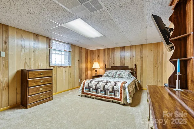 a bedroom with a bed and furniture