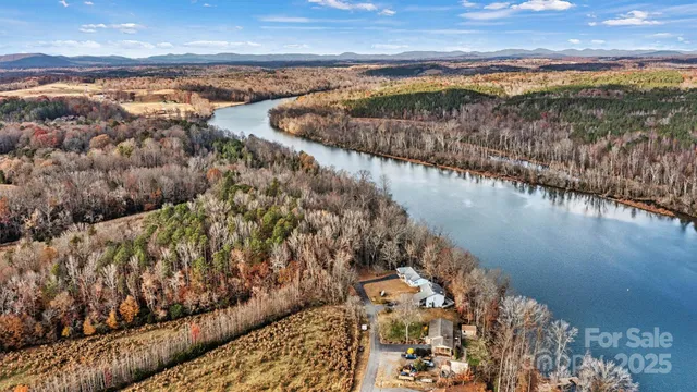 a view of road with large trees