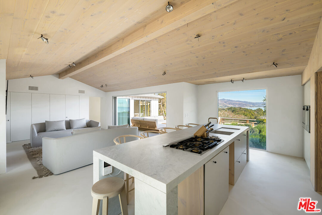 29500 Heathercliff Road, Unit 211 Malibu, CA 90265 - Photo 13 of 41 a kitchen with stainless steel appliances granite countertop a sink and cabinets