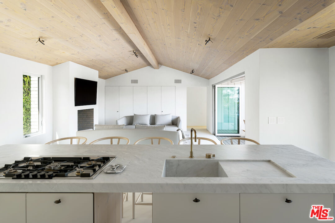 29500 Heathercliff Road, Unit 211 Malibu, CA 90265 - Photo 14 of 41 a kitchen with stainless steel appliances granite countertop a sink stove and cabinets