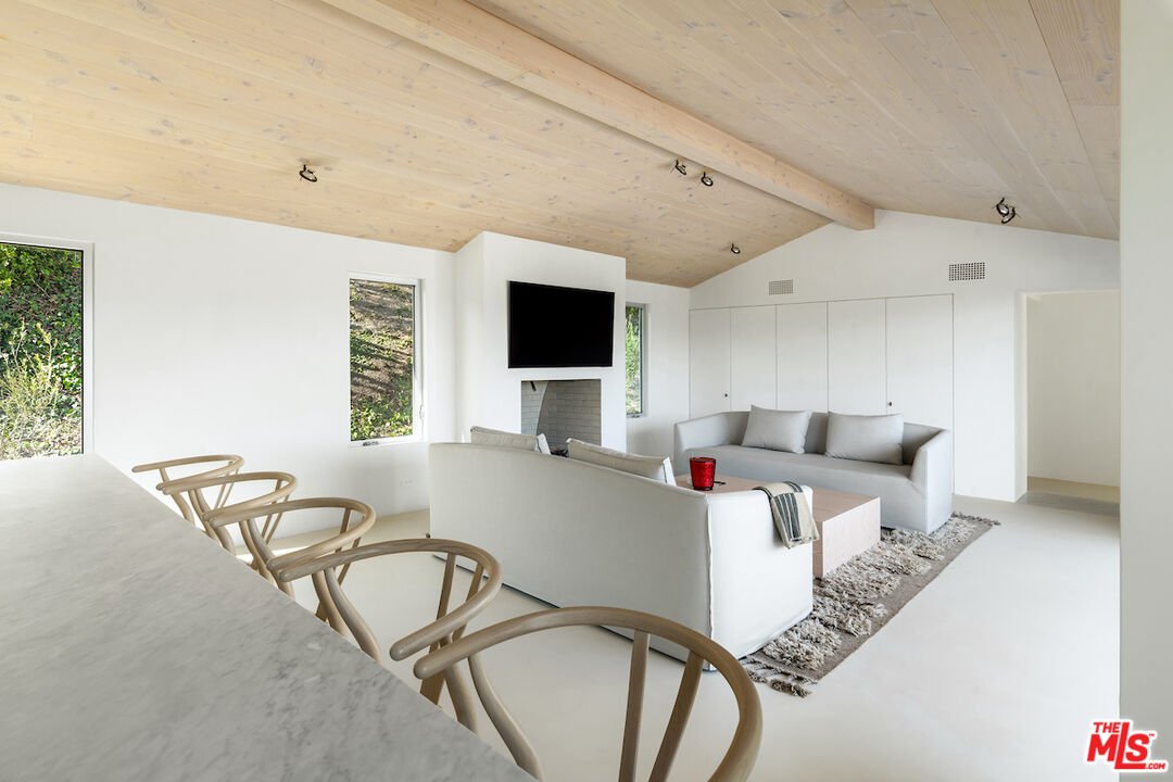 29500 Heathercliff Road, Unit 211 Malibu, CA 90265 - Photo 16 of 41 a living room with furniture and a flat screen tv