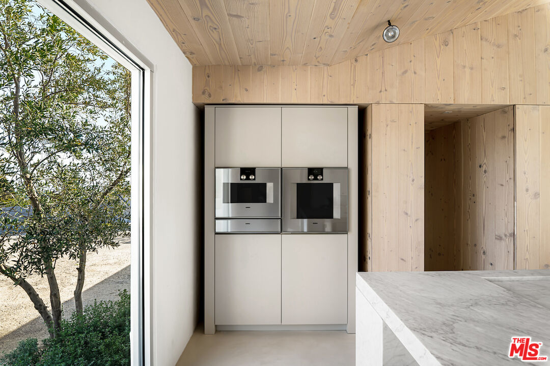 29500 Heathercliff Road, Unit 211 Malibu, CA 90265 - Photo 18 of 41 a view of kitchen living room