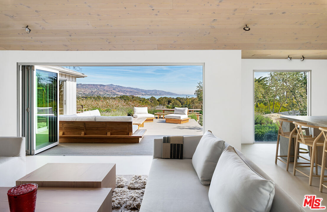 29500 Heathercliff Road, Unit 211 Malibu, CA 90265 - Photo 23 of 41 a living room with furniture and a large window