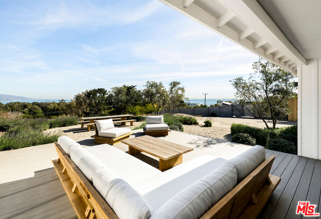 29500 Heathercliff Road, Unit 211 Malibu, CA 90265 - Photo 29 of 41 a view of a patio with furniture