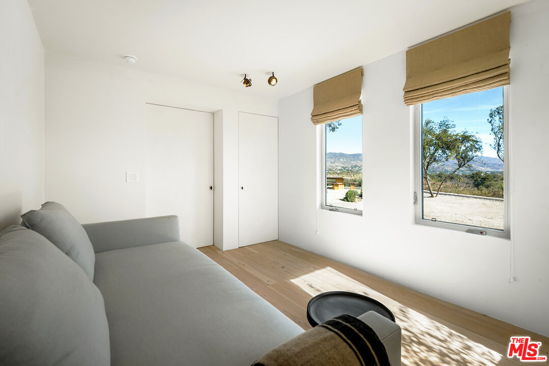 29500 Heathercliff Road, Unit 211 Malibu, CA 90265 - Photo 39 of 41 a bedroom with a bed and a window