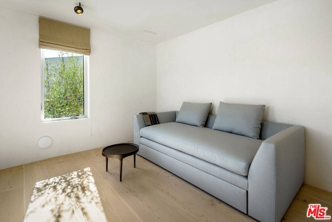 29500 Heathercliff Road, Unit 211 Malibu, CA 90265 - Photo 40 of 41 a bedroom with a bed and a lamp next to a window