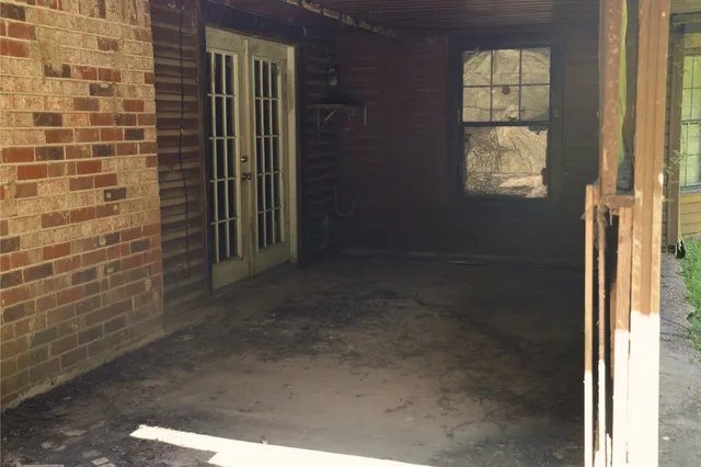 a view of hallway with windows