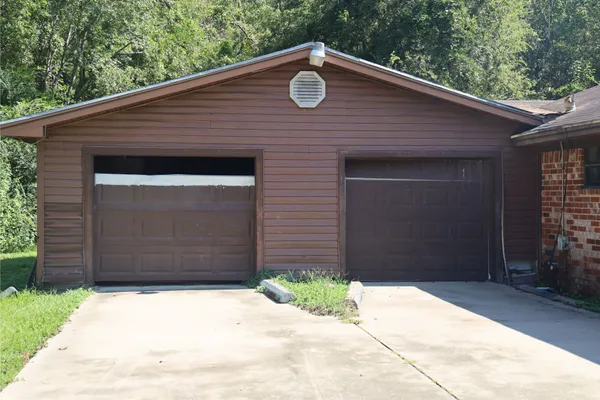 a front view of a house with a garage
