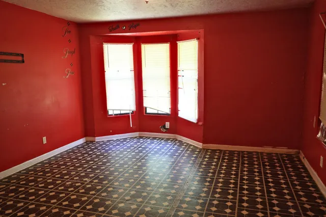 a view of an empty room and window