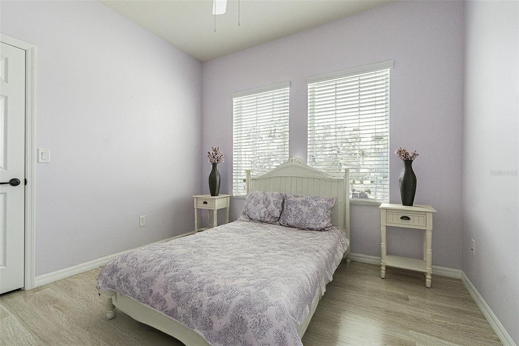 4256 Ashton Meadows Way Wesley Chapel, FL 33543 - Photo 19 of 42 a bedroom with a bed and window