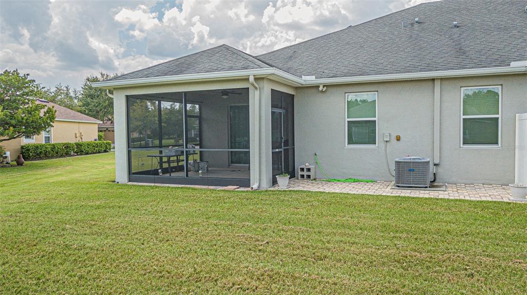 4256 Ashton Meadows Way Wesley Chapel, FL 33543 - Photo 25 of 42 a house with garden in front of it
